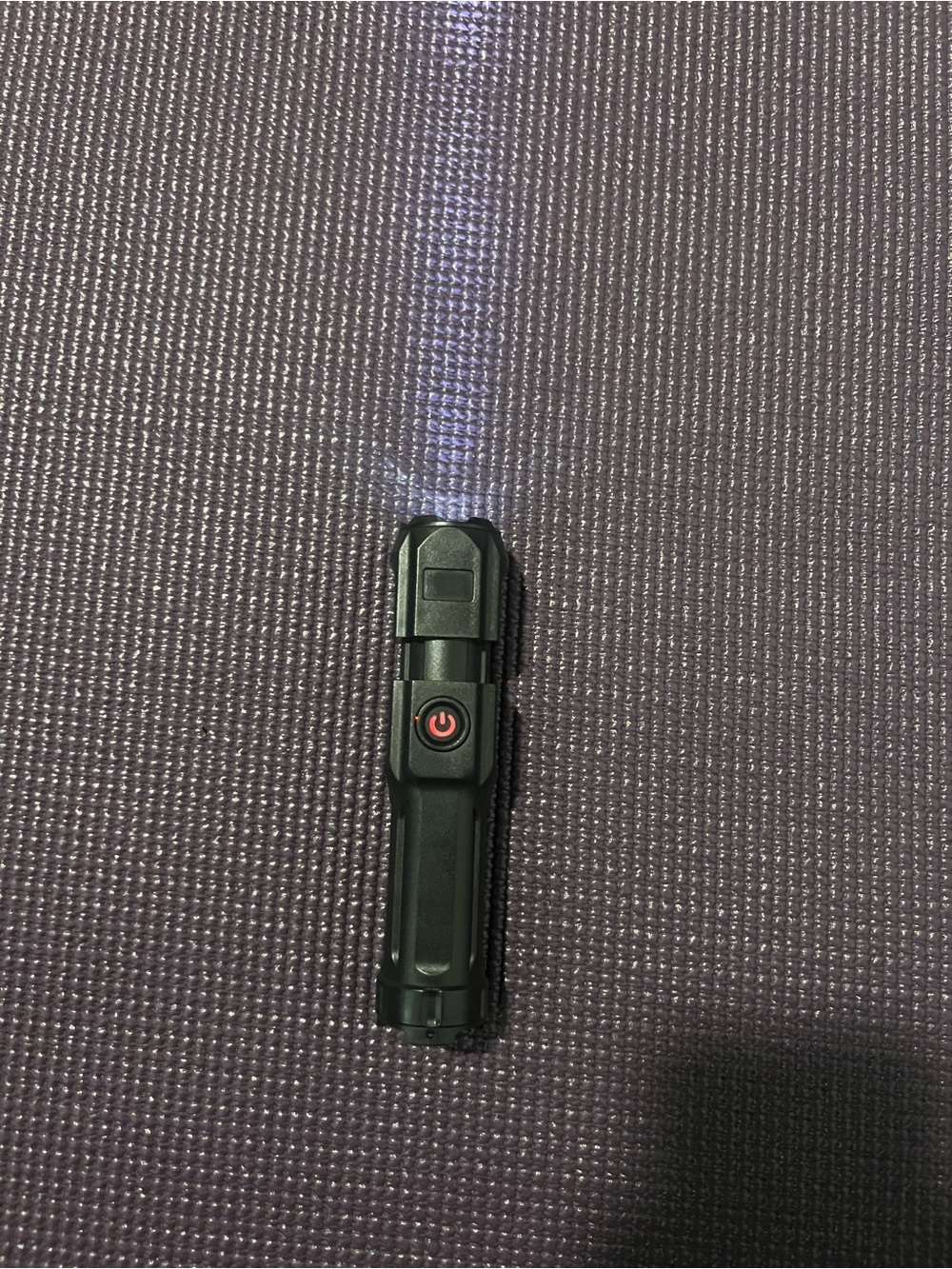 Compact Black LED Flashlight with Single-Button Control - Picture 2 of 5